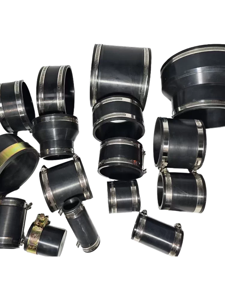 iksonic-flexible-rubber-pipe-couplings-assortment Assortment of black straight and reducing rubber pipe couplings with metal clamps.
