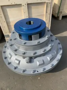 IKSONIC fluid coupling with a blue upper hub and central keyed bore above a bolted silver housing.