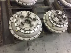 Two fluid coupling examples showing upper mounting interfaces and bolted housings, supplied by IKSONIC