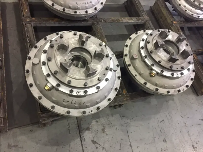 Two fluid coupling examples showing upper mounting interfaces and bolted housings, supplied by IKSONIC