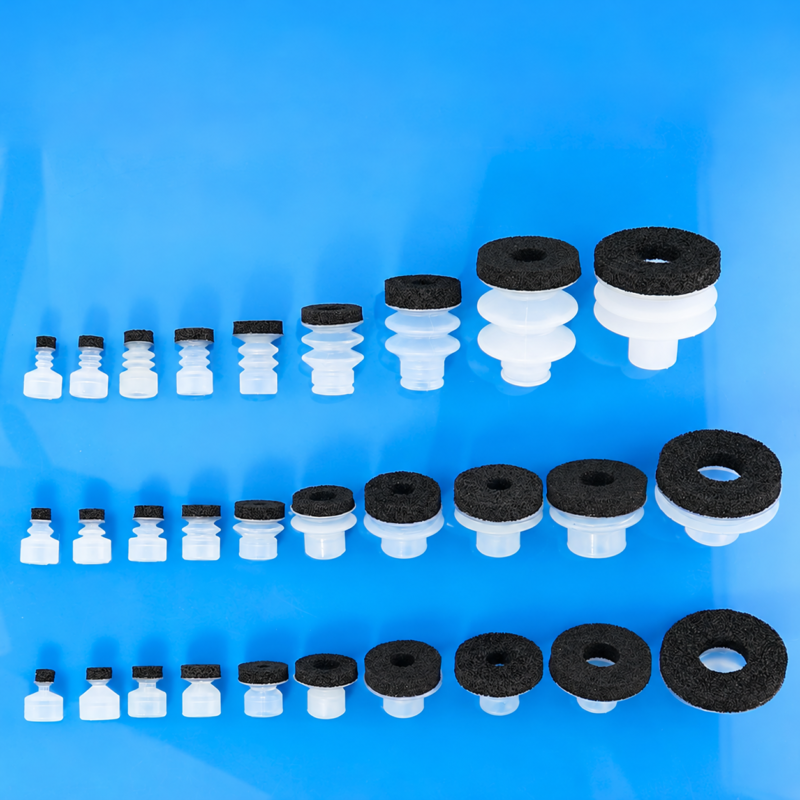 IKSONIC foam vacuum suction cup series IKSONIC SP, DP and MP foam vacuum suction cups with white silicone bodies and black foam pads.