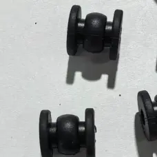 Side close-up of black gimbal vibration dampers from the IKSONIC supplier catalog.