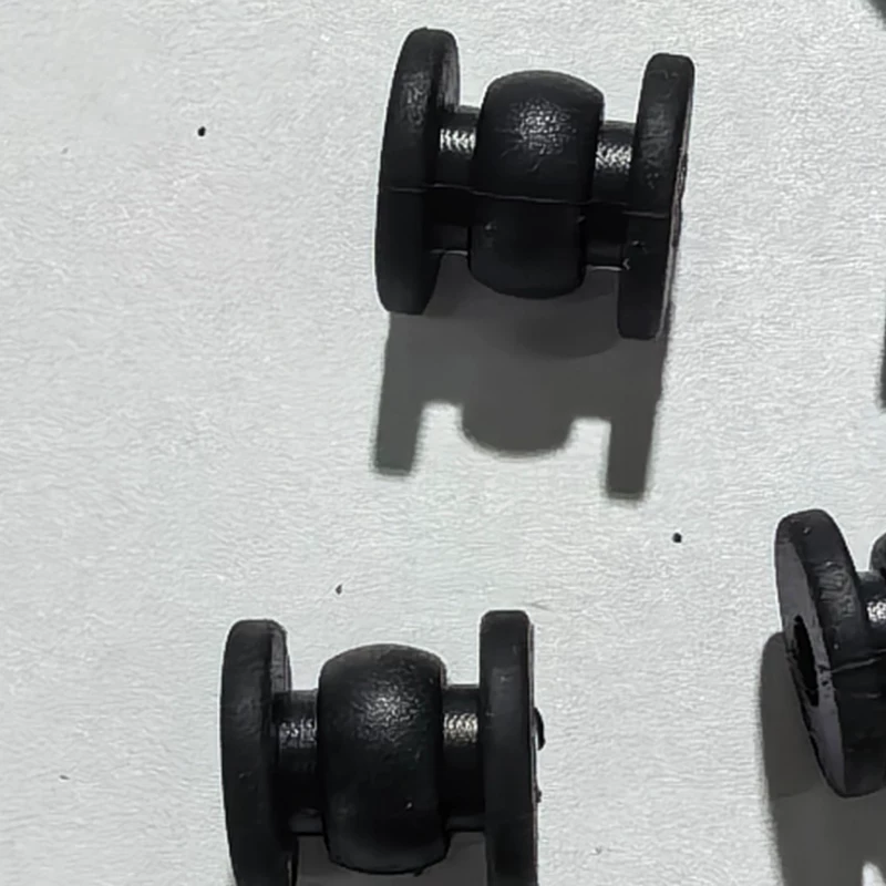 Side close-up of black gimbal vibration dampers from the IKSONIC supplier catalog.