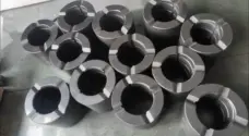 Assortment of IKSONIC graphite bushings showing different sleeve profiles.
