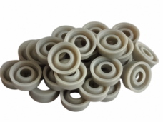 Gray polyurethane Y-seals showing recessed sealing faces and central bores, supplied by IKSONIC China.