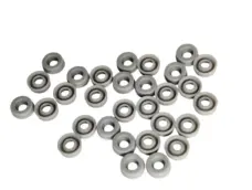 Gray dispensing cylinder seals arranged face up and face down, IKSONIC product view.