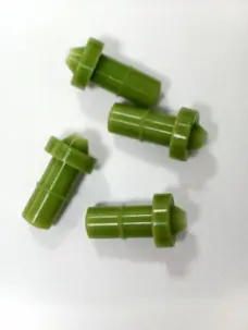 Four green rubber dispensing nozzles showing flanges and stepped bodies, supplied by IKSONIC China.