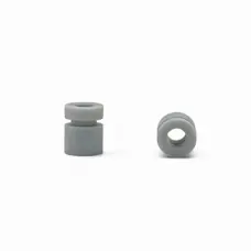 Side and end views of grey cylindrical damping parts showing the groove and central opening, from IKSONIC supplier.