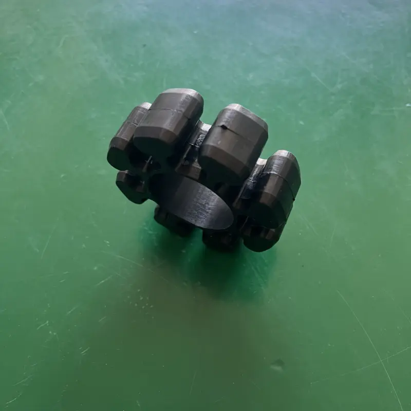 Side view of a black lobed grinder coupling insert showing its thickness, supplied through IKSONIC