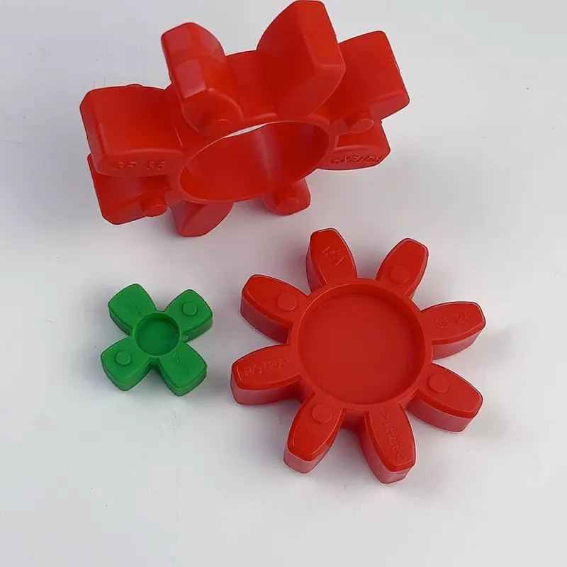 Angled and front views of red and green GS coupling inserts for IKSONIC wholesale sourcing; the upper insert is partly outside the frame.