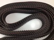 Close view of black H-profile belt teeth in folded loops, IKSONIC wholesale belt supply.