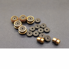 IKSONIC supplier photo of hot-melt needle seal components and copper-coloured housings in an overview arrangement.