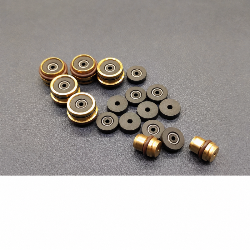 iksonic-hot-melt-needle-seals-housings-supplier-overview IKSONIC supplier photo of hot-melt needle seal components and copper-coloured housings in an overview arrangement.