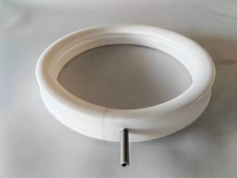 IKSONIC inflatable seal ring valve detail White IKSONIC inflatable seal ring with a threaded metal air connection.