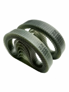 Overlapping coils of translucent polyurethane L-profile timing belt, showing the toothed inner surface and reinforcing lines. Structural example supplied by IKSONIC in China.