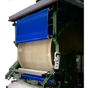 Blue and light-coloured mesh belts fitted to lamination equipment, illustrating an IKSONIC belt application.