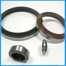 Assorted IKSONIC metal-cased rotary oil seals with black and brown sealing elements on a white background.