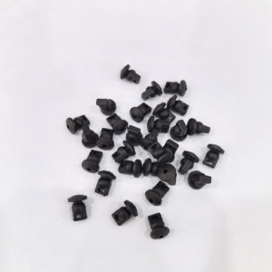 Black IKSONIC gimbal damping pieces for Mini 5 Pro in a scattered grouping, showing their flanges and mounting openings.