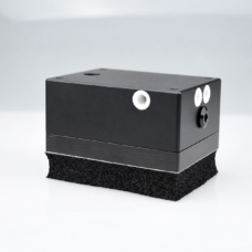 IKSONIC compact foam vacuum gripper body with pneumatic ports and a foam contact pad.