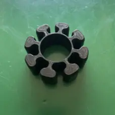 Face detail of a black grinder coupling insert and central opening, IKSONIC wholesale enquiry