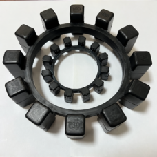 Two IKSONIC NBR coupling rings showing their projecting drive blocks and molded material and model markings.