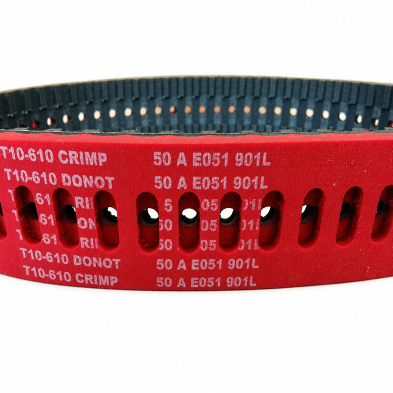 Perforated red-coated IKSONIC film-pulling timing belt showing slots and inner teeth.