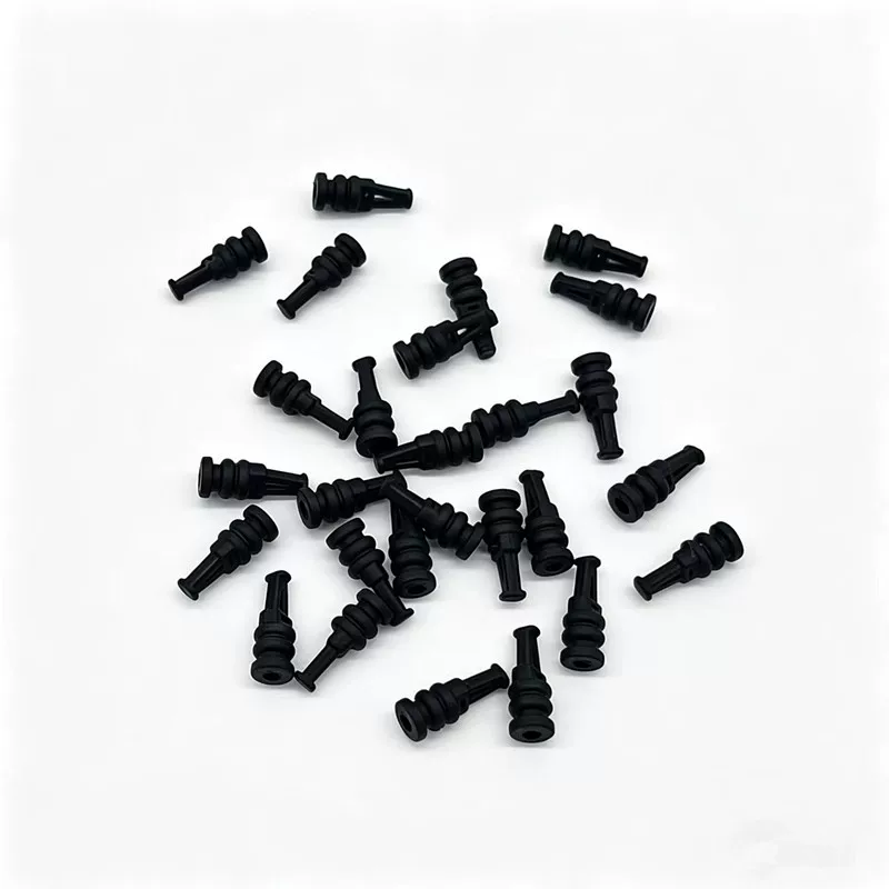 Assortment of black pointed silicone damping parts in different orientations, from IKSONIC China supplier.