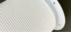 White PTFE bellows close-up showing corrugations and mounting holes in the end flange; supplied by IKSONIC in China.