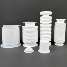 White PTFE bellows and flanged expansion joints in six different sizes; supplied by IKSONIC in China.
