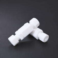 Two white PTFE check valves arranged in a crossed position, showing compression nuts and threaded connections; IKSONIC PTFE valve supply example.