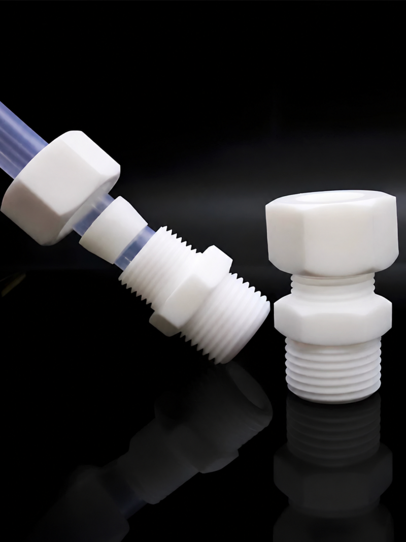 iksonic-ptfe-compression-connectors-china-supplier White PTFE compression connector with separated nut and ferrule on translucent tubing, supplied by IKSONIC in China