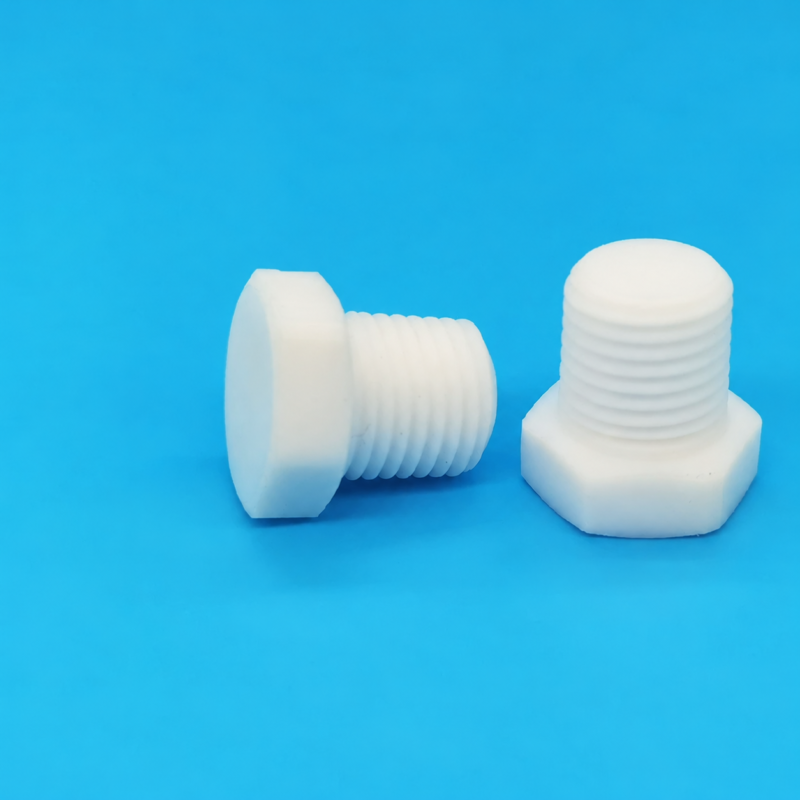 iksonic-ptfe-hex-head-pipe-plugs-china-supplier-blue-two-views Two white PTFE hex-head threaded pipe plugs, one horizontal and one upright, on a blue background; supplied by IKSONIC in China.