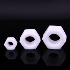Three white PTFE hex nuts in different sizes with visible internal threads, supplied by IKSONIC in China
