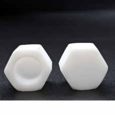 White PTFE hexagonal pipe caps showing the opening and closed end, supplied by IKSONIC in China