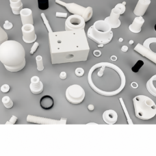Assorted machined components with a drilled block, bushings and rings, from IKSONIC China supplier.
