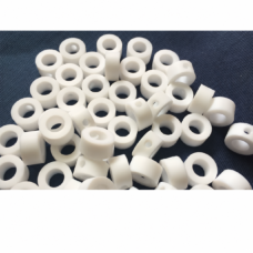 Short white PTFE sleeves, including pieces with radial holes, available from IKSONIC