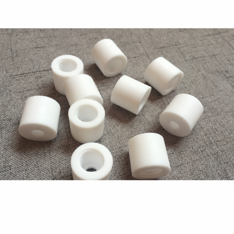 White PTFE sleeves showing recessed cavities and smaller openings, IKSONIC supply examples