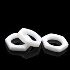Three white PTFE thin hex nuts on a reflective black surface, shown for the IKSONIC supplier catalog.