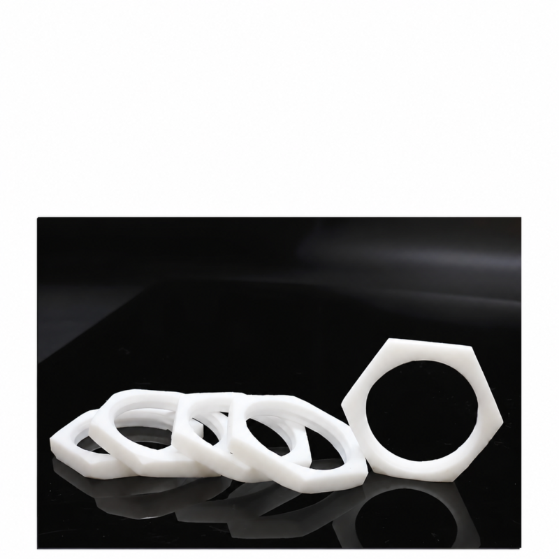 Overlapping white PTFE thin hex nuts with one nut standing upright at the right, shown for the IKSONIC wholesale catalog.