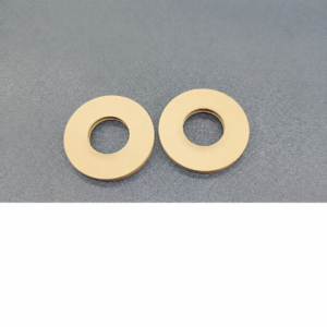 Plain faces and central openings of two IKSONIC tan rotary evaporator seal gaskets.