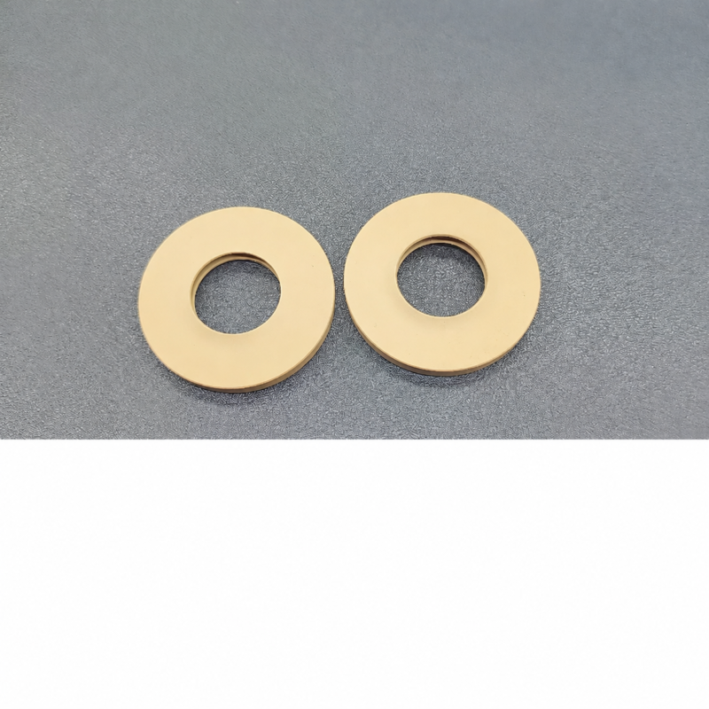 Plain faces and central openings of two IKSONIC tan rotary evaporator seal gaskets.