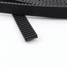 Tooth and edge detail of an IKSONIC rubber elevator door timing belt.