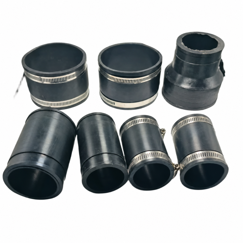 iksonic-rubber-coupling-seven-component-arrangement Seven black rubber pipe coupling components, including clamped couplings and a reducer, offered by IKSONIC China supplier.