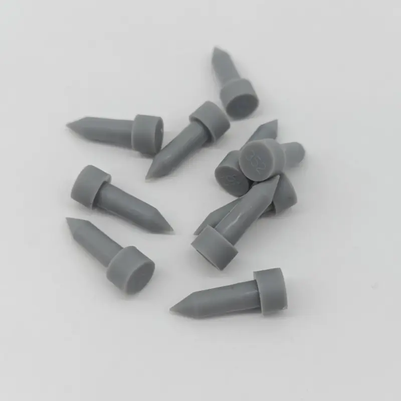 Grey silicone dust plugs with visible 352 markings, IKSONIC supplier photograph