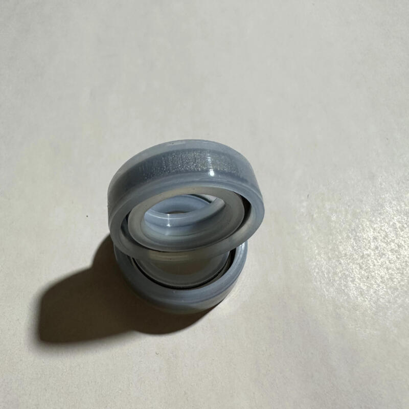 Stacked IKSONIC silicone oil seal pair showing axial profile and inner opening.