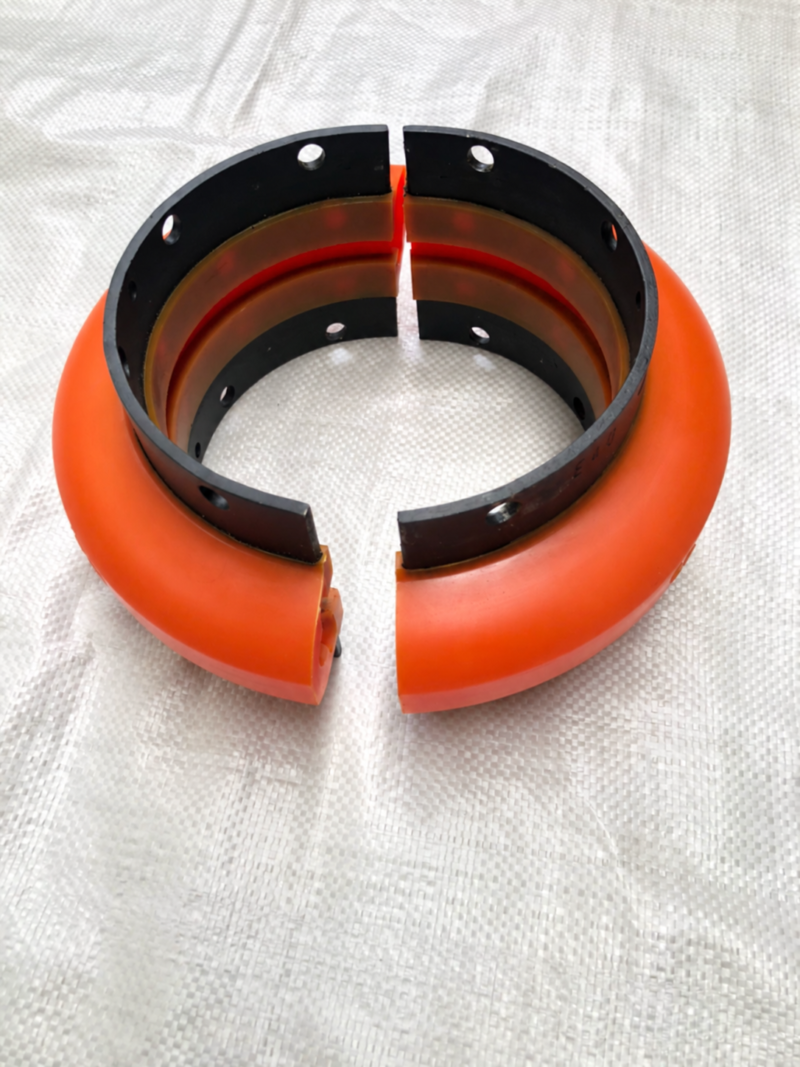 iksonic-split-coupling-element-manufacturer IKSONIC orange split coupling element with black mounting bands, shown as two matching halves.