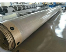 Brown conveyor belt roll with reinforced edge eyelets in the IKSONIC supplier catalog.