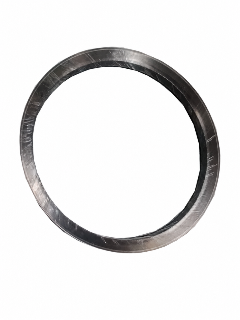 iksonic-supplier-graphite-self-sealing-ring-main-469 Single graphite self-sealing ring from an IKSONIC supplier, shown at an angle on a white background.