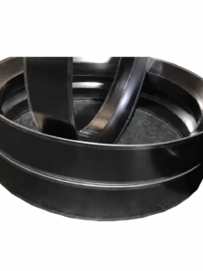 Close-up of overlapping IKSONIC graphite self-sealing rings showing the ring faces and inner profiles.