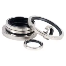 Imported finished stainless-steel PTFE oil seals with black inner lips in stacked and angled positions on a white background, supplied by IKSONIC.
